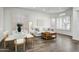 Bright living room with hardwood floors, dining area, and a comfortable couch at 10351 E Morning Star Dr, Scottsdale, AZ 85255