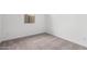 Bedroom with natural lighting, neutral carpeting, and a calming ambiance, offering comfort and style at 11660 W Luxton Ln, Avondale, AZ 85323