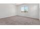 Neutral bedroom with carpet flooring, neutral paint, and large windows offering natural light at 11660 W Luxton Ln, Avondale, AZ 85323