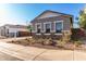 Charming single-Gathering home featuring stone accents, a well-manicured yard, and neutral-colored exterior at 11660 W Luxton Ln, Avondale, AZ 85323