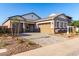 Beautiful single-story home boasts a three-car garage and a paved driveway at 11660 W Luxton Ln, Avondale, AZ 85323
