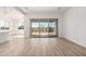 Bright living room with tile floors and sliding glass door leading to the backyard at 11660 W Luxton Ln, Avondale, AZ 85323