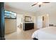Spacious main bedroom featuring a mounted TV, and ensuite bath at 12425 W Jefferson St, Avondale, AZ 85323