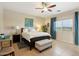 Serene main bedroom with a ceiling fan, neutral tones, and ample natural light at 12425 W Jefferson St, Avondale, AZ 85323