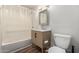Bathroom featuring a vanity with modern fixtures, and a shower-tub combination at 1424 S Bonarden Ln, Tempe, AZ 85281