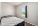 Bedroom with a comfortable mattress, natural light, and wood look flooring at 1424 S Bonarden Ln, Tempe, AZ 85281