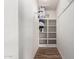 Walk-in closet with built-in shelving for storage at 1424 S Bonarden Ln, Tempe, AZ 85281
