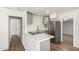 Updated kitchen with stainless steel appliances, white countertops, and modern gray cabinets at 1424 S Bonarden Ln, Tempe, AZ 85281