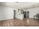 An open-concept living room flows into the kitchen area with new flooring at 1424 S Bonarden Ln, Tempe, AZ 85281