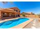 Home featuring a private pool, patio, and a well-maintained gravel area at 1690 E Desert Breeze Ct, Casa Grande, AZ 85122