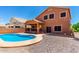 Home featuring a private pool, patio, and a well-maintained gravel area at 1690 E Desert Breeze Ct, Casa Grande, AZ 85122