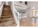 Bright entryway featuring a staircase and French doors to the backyard with a high ceiling at 1690 E Desert Breeze Ct, Casa Grande, AZ 85122