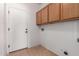 Functional laundry room with overhead cabinets and hookups for a washer and dryer at 1690 E Desert Breeze Ct, Casa Grande, AZ 85122