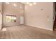 Open-concept living room with a two-story ceiling and large windows offering ample natural light at 1690 E Desert Breeze Ct, Casa Grande, AZ 85122