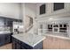 Expansive living space showcasing stainless steel appliances, marble countertop, and open floor plan at 1690 E Desert Breeze Ct, Casa Grande, AZ 85122