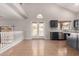 Open living space with backyard views, French doors, and neutral tile flooring at 1690 E Desert Breeze Ct, Casa Grande, AZ 85122