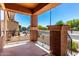 View from the porch showing decorative iron railings and views of the landscaped front yard at 1690 E Desert Breeze Ct, Casa Grande, AZ 85122