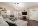 Inviting living room with vaulted ceilings, wood floors, and a stylish sectional sofa at 1736 E Villa Maria Dr, Phoenix, AZ 85022