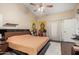 Spacious main bedroom features a modern bed frame, neutral walls, and ample natural light at 1736 E Villa Maria Dr, Phoenix, AZ 85022