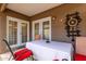Covered patio area with a table and chairs, offering a comfortable outdoor living space at 1736 E Villa Maria Dr, Phoenix, AZ 85022