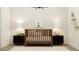 Cozy Bedroom with a brown crib, lamps on matching nightstands, and a cute bunny portrait at 17551 W Victory St, Goodyear, AZ 85338