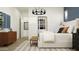 Comfortable main bedroom with a king bed, modern decor, and plenty of natural light at 17551 W Victory St, Goodyear, AZ 85338