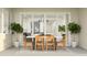 Outdoor patio with a dining table, chairs, and sliding glass doors at 17551 W Victory St, Goodyear, AZ 85338