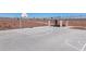 Aerial view of a community basketball court with a sheltered picnic area, designed for recreational activities and enjoyment at 17563 W Victory St, Goodyear, AZ 85338