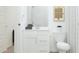 This bright bathroom features a sleek white vanity and toilet at 17563 W Victory St, Goodyear, AZ 85338