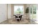 Cozy dining area with natural light, a round table, and views of the outdoors at 17563 W Victory St, Goodyear, AZ 85338