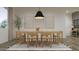 Elegant dining room with natural wood furniture and tasteful decor at 17563 W Victory St, Goodyear, AZ 85338