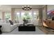 Comfortable living room featuring modern furniture, large windows, and tasteful decor at 17563 W Victory St, Goodyear, AZ 85338