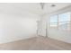 Neutral bedroom with carpet, a ceiling fan, and plenty of natural light at 17813 W Pinnacle Vista Dr, Surprise, AZ 85387