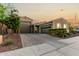 Inviting home showcasing a spacious driveway and beautifully landscaped front yard at 17813 W Pinnacle Vista Dr, Surprise, AZ 85387