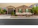 Charming single-story home featuring a well-manicured front yard and a two-car garage at 17813 W Pinnacle Vista Dr, Surprise, AZ 85387