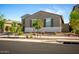 Charming single-story house featuring drought-resistant landscaping and a well-kept appearance at 17813 W Pinnacle Vista Dr, Surprise, AZ 85387
