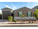 Attractive single-Gathering home displaying a well-maintained lawn and a convenient two-car garage at 17813 W Pinnacle Vista Dr, Surprise, AZ 85387