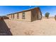 Backyard features neutral paint, gravel, and ample space at 19887 N Herbert Ave, Maricopa, AZ 85138