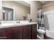 Bathroom features a white sink, neutral wall paint, and modern decor at 19887 N Herbert Ave, Maricopa, AZ 85138