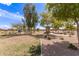 Beautiful community park with lush landscaping, walking paths, and mature trees offering shade at 19887 N Herbert Ave, Maricopa, AZ 85138