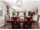 Elegant dining room with a chandelier and comfortable seating for Gathering gatherings at 19887 N Herbert Ave, Maricopa, AZ 85138