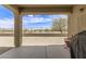 Spacious covered patio with a view of the backyard and desert landscape at 19887 N Herbert Ave, Maricopa, AZ 85138
