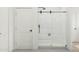 Modern bathroom featuring a glass enclosed shower with black hardware and white subway tiles at 20309 W Roma Ave, Buckeye, AZ 85396