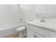 Bright bathroom featuring a tub/shower combo, white subway tile, and a white vanity at 20302 W Turney Ave, Buckeye, AZ 85396
