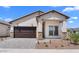 Attractive single-Gathering home featuring a two-car garage, well-maintained landscaping, and a welcoming entrance at 20302 W Turney Ave, Buckeye, AZ 85396