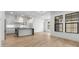 Bright kitchen features modern cabinetry, an island with seating, and stainless steel appliances at 20302 W Turney Ave, Buckeye, AZ 85396