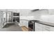 Modern kitchen featuring stainless steel appliances, white cabinetry, and sleek countertops at 20302 W Turney Ave, Buckeye, AZ 85396
