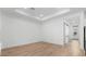 Spacious living room with wood-look flooring, recessed lights, and barn doors to the exterior at 20302 W Turney Ave, Buckeye, AZ 85396