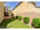 Beautiful backyard featuring turf, low shrubbery, and neutral-toned two-story house, perfect for outdoor enjoyment at 20733 W Alsap Rd, Buckeye, AZ 85396