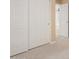 Bedroom featuring carpet, closet with sliding doors, and an open doorway to the next room at 20733 W Alsap Rd, Buckeye, AZ 85396